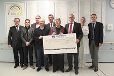 v.l.n.r.: Michael Walter, Timo Streit, Thomas Schreiber, Christian Pawletta, Ralph Weikgenannt, Gudrun Schütte, Michael Heimann, Dr. Alfred Leipold, Markus Heming. Bildquelle: Petra Geiger, Städtisches Klinikum Karlsruhe