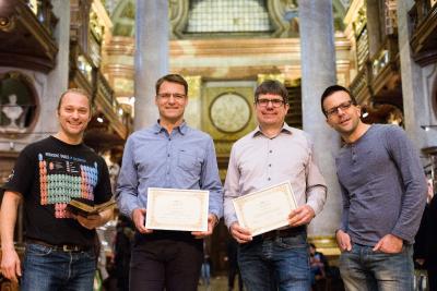 Freuen sich über die Auszeichnung: Dr. Thomas Layer, Dr. Michael Fink, Dipl. math. Georg Mackenbrock, Michael Sprinzl, BSc (v.l.n.r.)