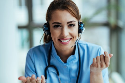 young-happy-healthcare-worker-wearing-headset-talking-with-patients-while-working-call-center Im.jpg