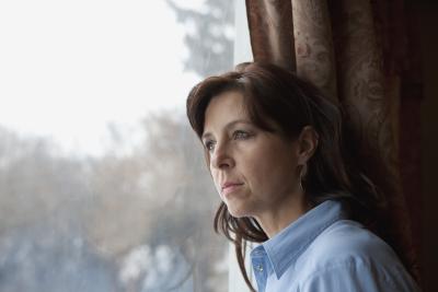 Woman leaning on window: Image by © Ron NickelDesign PicsCorbis