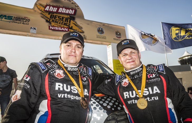 2014-Abu-Dhabi-Desert-Challenge,---winner,-podium,-Konstantin-Zhiltsov,-Vladimir-Vasilyev,-.jpg