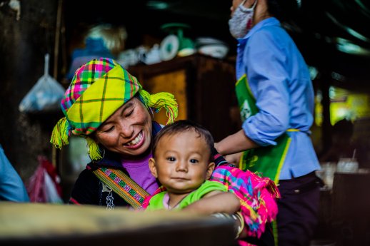Intrepid Travel-vietnam_sapa_mother-smiling-at-baby-fluro.jpg