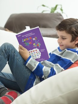 boy-reading-a-book-mockup-at-the-studio-a19205 (1).png