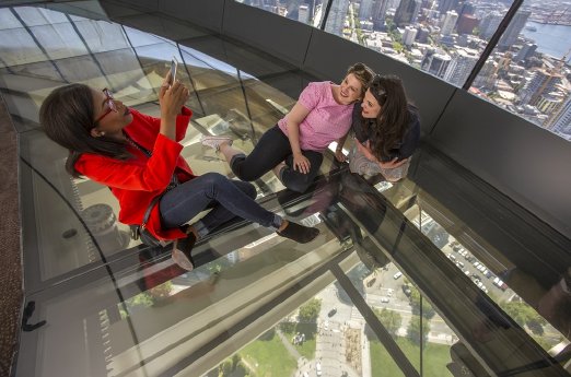 Guests pose for photo on The Loupe - first revolving glass floor. Courtesy of John Lok and Space.jpg