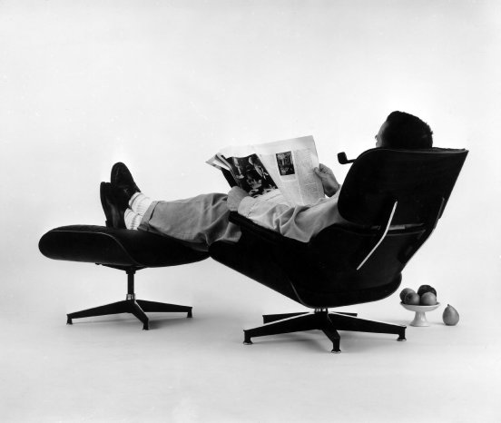 08. The World of Charles and Ray Eames. Charles Eames in the plywood Lounge and Ottoman, 1956. ©.jpg