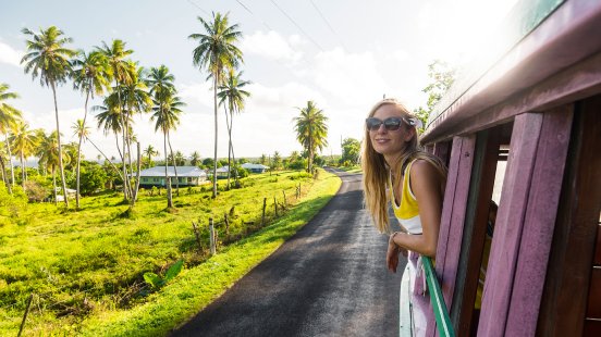 375561-woman-leans-out-window-of-public-bus_credit_Samoa_Tourism_Authority-web.jpg
