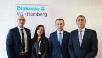 (von links): Johannes Miller, Qendresa Ptqaj, Arbeits- und Sozialminister Skender Reçica und Oberkirchenrat Dieter Kaufmann