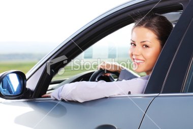 istockphoto_13703464-business-woman-looking-at-camera-through-the-car-window.jpg