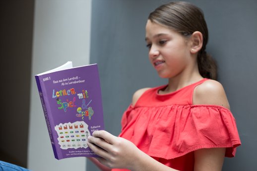 girl-reading-a-book-mockup-against-a-wall-a19081.png