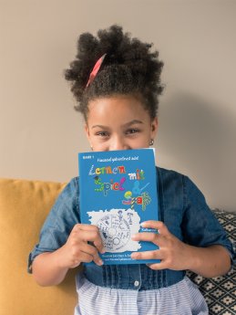 book-mockup-of-a-child-on-a-sofa-23723.png