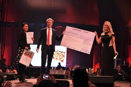 Juliana Gößmann, Christoph Hilligen from World Vision and Vicki Sorg from PM International announce the donation sum for 2019