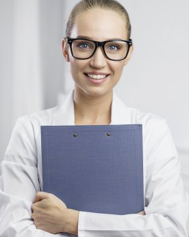 portrait-smiley-female-researcher-lab-with-clipboard (1).jpg