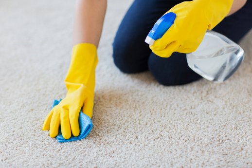 18953612_close-up-of-woman-with-cloth-cleaning-carpet.jpg